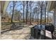 Outdoor back deck with furniture, a grill, and beautiful, wooded backyard views, perfect for enjoying meals and relaxing at 3271 Sutcliffe Nw Rdg, Marietta, GA 30064