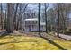 Lovely home exterior with a front porch and mature trees adding curb appeal at 3271 Sutcliffe Nw Rdg, Marietta, GA 30064