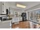 Modern kitchen with stainless steel appliances, white cabinetry, and hardwood floors for a sleek design at 3271 Sutcliffe Nw Rdg, Marietta, GA 30064