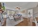 Well-lit living room with hardwood floors, fireplace, and neutral tones creating a warm atmosphere at 3271 Sutcliffe Nw Rdg, Marietta, GA 30064