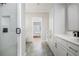 Long bathroom view with standup shower and vanity at 906 Bingham St, Woodstock, GA 30188