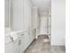 Bathroom featuring gray tiled floors and white cabinets at 906 Bingham St, Woodstock, GA 30188