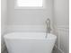 Bright bathroom featuring a modern soaking tub at 906 Bingham St, Woodstock, GA 30188
