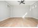 Spacious bedroom with hardwood floors and plenty of natural light from the large windows at 906 Bingham St, Woodstock, GA 30188