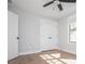 Cozy bedroom featuring double door closet and a large window at 906 Bingham St, Woodstock, GA 30188