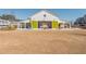 Barn style community space for events with green doors and outdoor seating at 906 Bingham St, Woodstock, GA 30188