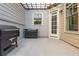 Outdoor patio with a barbecue and lights at 906 Bingham St, Woodstock, GA 30188
