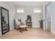 Comfortable sitting room with chair, ottoman, and natural light at 906 Bingham St, Woodstock, GA 30188