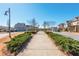 Well-maintained street with sidewalks and landscaping offers a scenic path through the residential neighborhood at 906 Bingham St, Woodstock, GA 30188