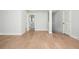 Upstairs hall featuring hardwood floors and bathroom entrance at 906 Bingham St, Woodstock, GA 30188