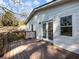 Back deck with white siding, and wooden railings with view to the backyard at 1764 Springview Nw Rd, Atlanta, GA 30314