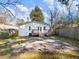 Backyard with a paver patio, green grass, shed, and a view of the home's exterior at 1764 Springview Nw Rd, Atlanta, GA 30314