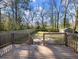 Spacious backyard with a patio, wood deck, wooden fence, and mature trees at 1764 Springview Nw Rd, Atlanta, GA 30314