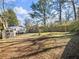 Wide backyard featuring a shed, paver patio, some grass, and a wooden fence at 1764 Springview Nw Rd, Atlanta, GA 30314