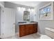 Bathroom with vanity, a decorative glass sink, stylish lighting, and a large window with a view at 1764 Springview Nw Rd, Atlanta, GA 30314