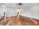 Bedroom with hardwood floors, tray ceilings, recessed lighting, and an open hallway at 1764 Springview Nw Rd, Atlanta, GA 30314