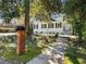 Curb appeal of the white painted brick home with black shutters and a well maintained front lawn at 1764 Springview Nw Rd, Atlanta, GA 30314