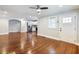 Open-concept living space with hardwood floors flowing into a kitchen with stainless appliances at 1764 Springview Nw Rd, Atlanta, GA 30314