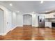 Bright, open concept living space features hardwood floors, white cabinets and stainless appliances at 1764 Springview Nw Rd, Atlanta, GA 30314