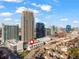 Aerial view of townhomes with a city skyline backdrop, perfect for urban living at 223 16Th Nw St # 2, Atlanta, GA 30363