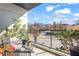 Relaxing outdoor balcony featuring comfortable seating, potted plants, and a neighborhood view at 223 16Th Nw St # 2, Atlanta, GA 30363