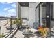 Outdoor balcony with stainless steel grill, seating, and a view of the city skyline at 223 16Th Nw St # 2, Atlanta, GA 30363