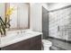 Well appointed bathroom with modern vanity, marble countertop, and glass-enclosed shower with stylish tile accents at 223 16Th Nw St # 2, Atlanta, GA 30363
