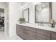 Elegant bathroom with double sinks, modern vanity, and marble floors at 223 16Th Nw St # 2, Atlanta, GA 30363