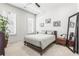 Modern bedroom with grey accent colors and a full size mirror with two large windows allowing natural light at 223 16Th Nw St # 2, Atlanta, GA 30363