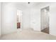 Clean bedroom with neutral carpet has access to the bathroom and walk in closet with stylish white paneled doors at 223 16Th Nw St # 2, Atlanta, GA 30363