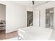 Minimalist bedroom with hardwood floors, closet, and spa-like bathroom at 223 16Th Nw St # 2, Atlanta, GA 30363