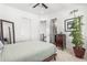 Modern bedroom with grey accent colors featuring an indoor plant and view of the stairway at 223 16Th Nw St # 2, Atlanta, GA 30363