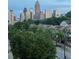 Daytime Atlanta skyline view, over treed neighborhood and quiet street at 223 16Th Nw St # 2, Atlanta, GA 30363
