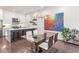 Bright dining area featuring modern table, stylish chairs, and colorful artwork adjacent to the kitchen at 223 16Th Nw St # 2, Atlanta, GA 30363