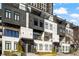 Modern townhome exterior featuring a sleek design, multiple balconies, and manicured landscaping at 223 16Th Nw St # 2, Atlanta, GA 30363