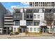 Striking townhome featuring multi-story balconies, sleek black and white design, and convenient parking at 223 16Th Nw St # 2, Atlanta, GA 30363