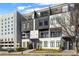 Modern apartment exterior with sleek design, multiple balconies, and landscaped yards at 223 16Th Nw St # 2, Atlanta, GA 30363