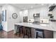 Contemporary kitchen with stainless steel appliances, large center island, and open shelving at 223 16Th Nw St # 2, Atlanta, GA 30363