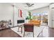 Chic living room with fireplace, hardwood floors, and sliding doors to private balcony at 223 16Th Nw St # 2, Atlanta, GA 30363