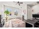 Bright living room featuring hardwood floors, large windows, modern ceiling fan, and minimalist decor at 223 16Th Nw St # 2, Atlanta, GA 30363