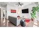 Stylish living room features a modern sofa, sleek furniture, and a sliding door to the patio with a view at 223 16Th Nw St # 2, Atlanta, GA 30363