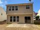 Back view of home with sliding glass door, patio and windows at 2643 Winslow Ridge Dr, Buford, GA 30519