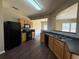 Well-equipped kitchen with black appliances and wood cabinetry at 2643 Winslow Ridge Dr, Buford, GA 30519