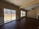 Living room with wood floors, fireplace and glass door to backyard at 2643 Winslow Ridge Dr, Buford, GA 30519