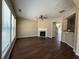 Spacious living room features wood floors, a fireplace, and large windows at 2643 Winslow Ridge Dr, Buford, GA 30519