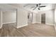 Spacious basement featuring light wood flooring, neutral paint, and a ceiling fan for comfort at 2682 Miriam Ln, Decatur, GA 30032