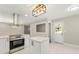 Modern kitchen featuring stainless steel appliances, an island, and an adjacent outdoor access at 2682 Miriam Ln, Decatur, GA 30032