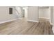 Spacious basement featuring light wood flooring, neutral walls, and stairway to the upper level at 2682 Miriam Ln, Decatur, GA 30032
