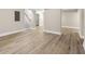 Spacious basement featuring durable wood flooring, neutral paint, and access to the upper floors via staircase at 2682 Miriam Ln, Decatur, GA 30032