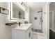 Modern bathroom with double sink vanity, illuminated mirror, and tiled walk-in shower at 2682 Miriam Ln, Decatur, GA 30032